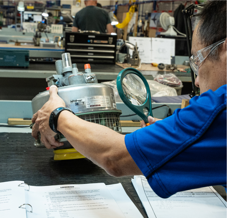 People testing a pneumatic system.